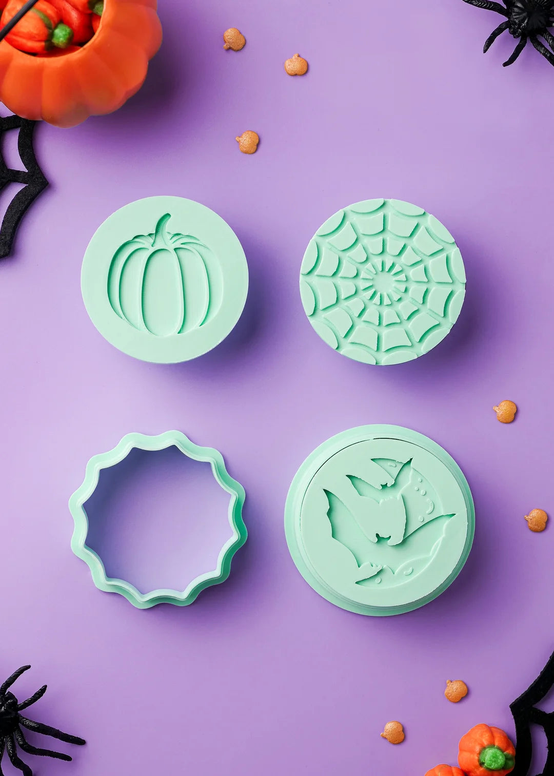 Set includes: 1 cookie stamp with pumpkin design, 1 cookie stamp with spiderweb design, 1 cookie stamp with flying bats and moon design, 1 round cookie cutter, 1 spiderweb cookie cutter. Diameter of cookie stamps is 55mm or 2.16 inches.