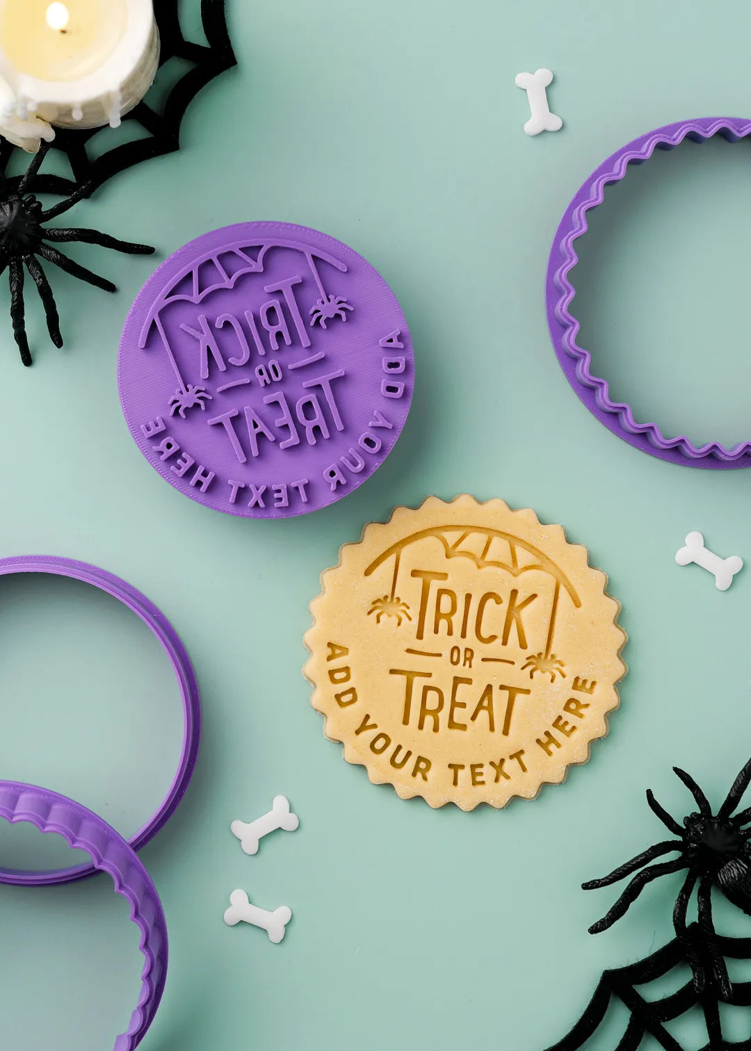 Halloween-themed cookie stamp with 'Trick or Treat' design on a green background.