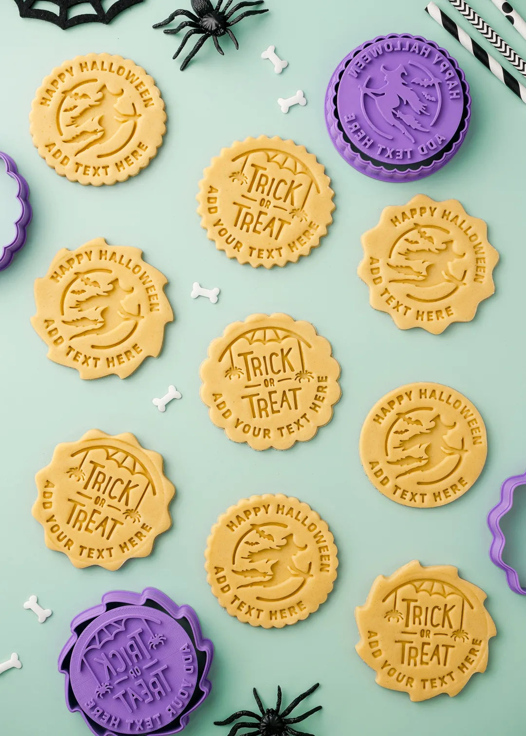 Halloween-themed cookies with text stamps on a light green background