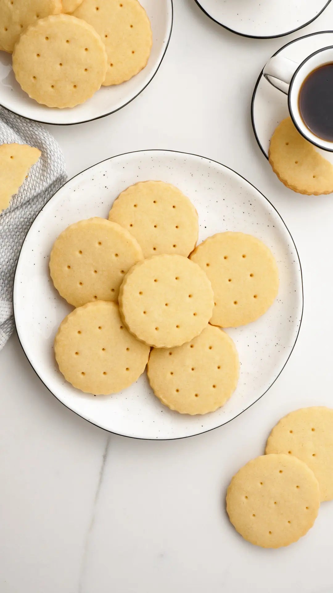 Perfectly baked shortbread cookies served on a plate with cup of coffee 