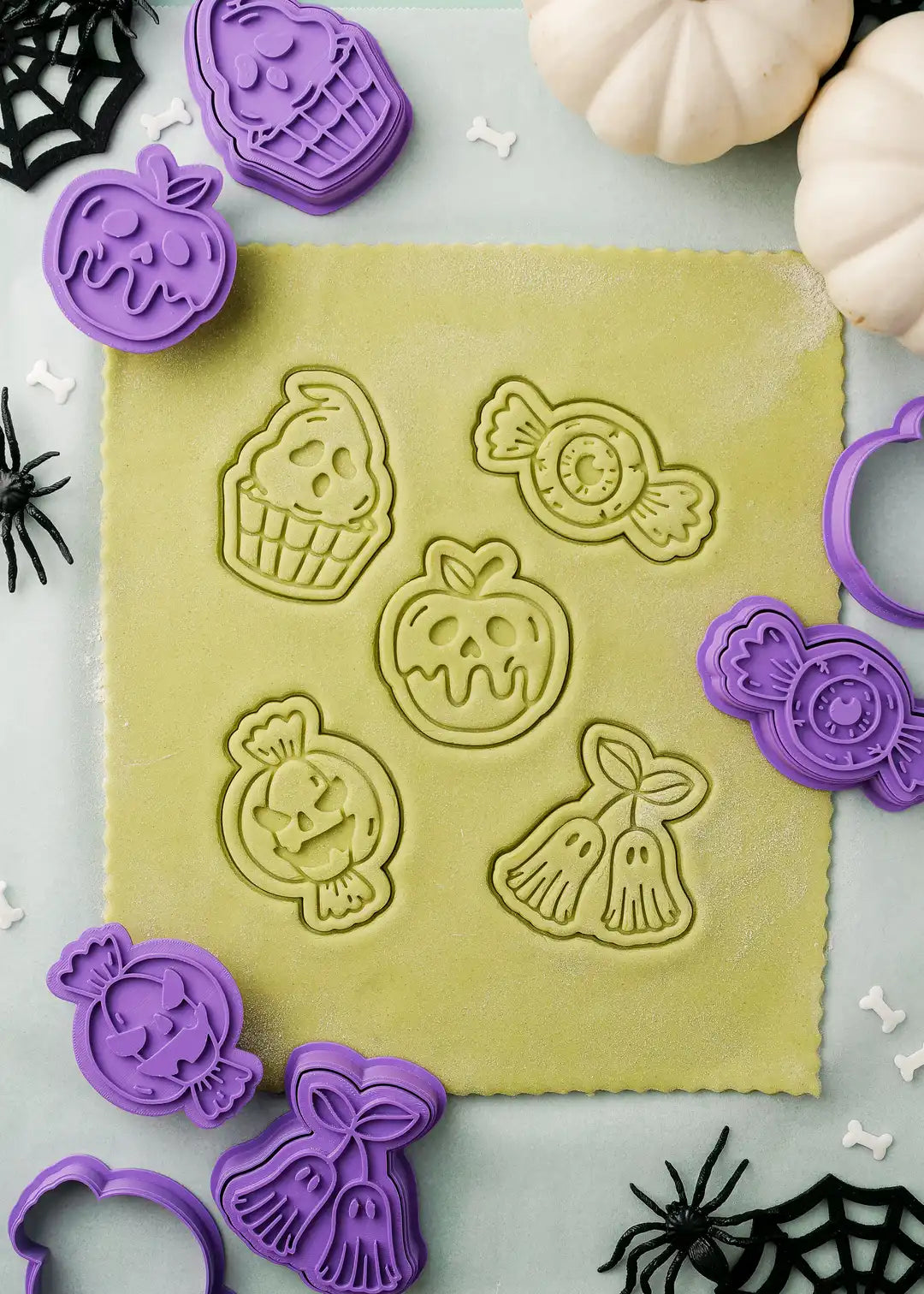 Display of cookie stamps pressed on rolled out dough. Each set also comes with a free ebook with recipes and helpful tips.