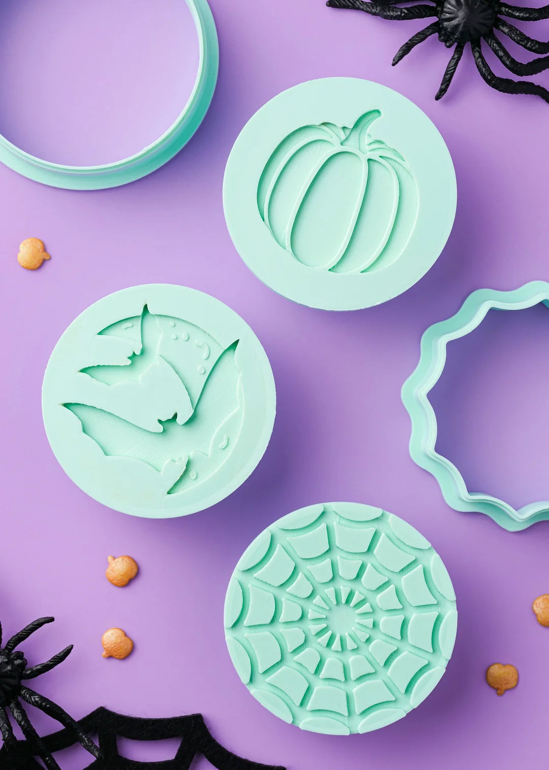 Close-up photo of the Halloween cookie stamps and cutters, shown separately.