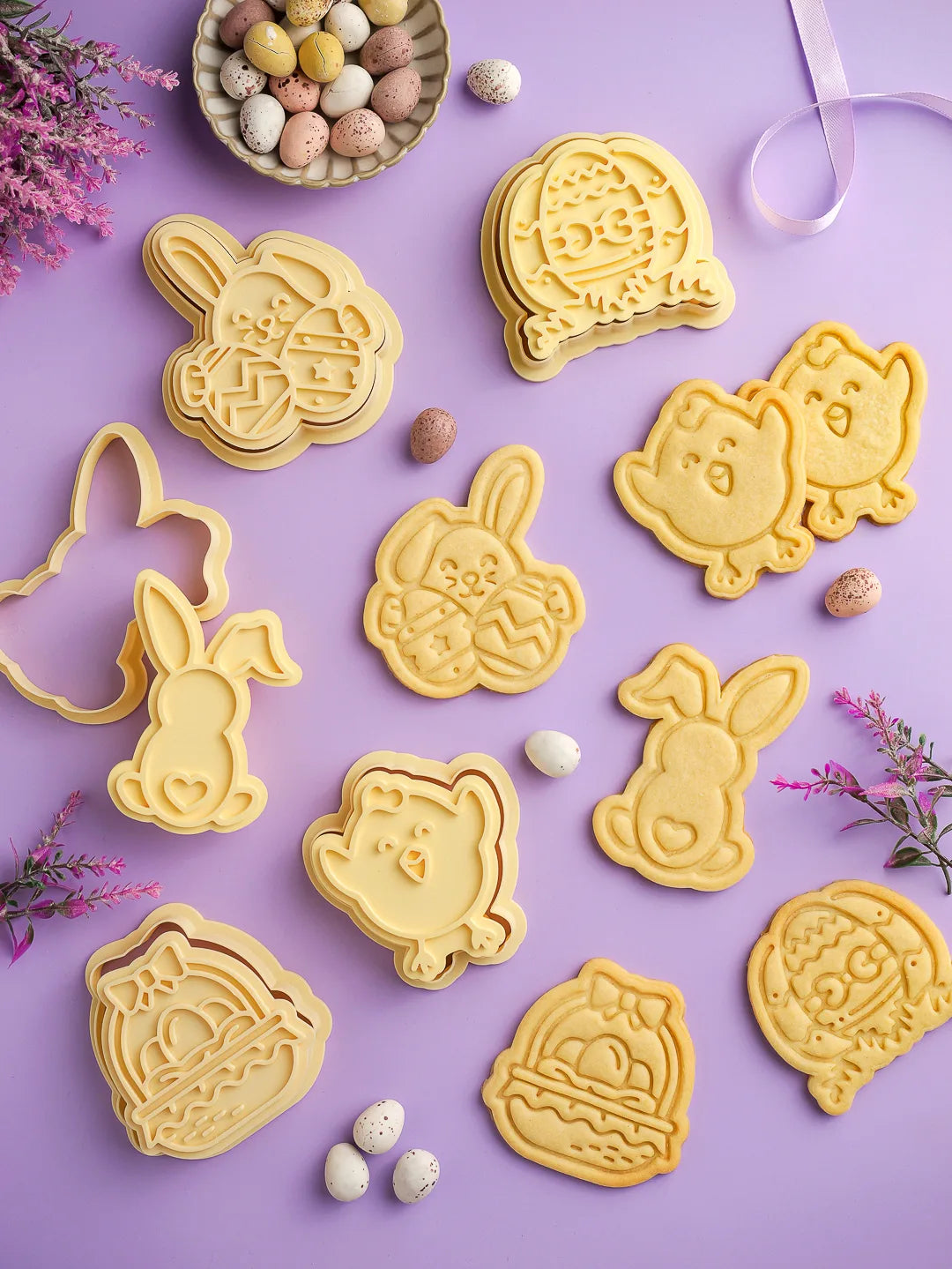 a  flat-lay composition of our Easter cookie cutters and stamps and some freshly baked cookies, prepared with them