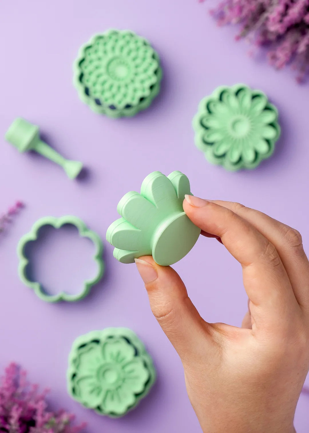 Comfortable handles of the cookie stamps. Showcasing the ergonomic handle