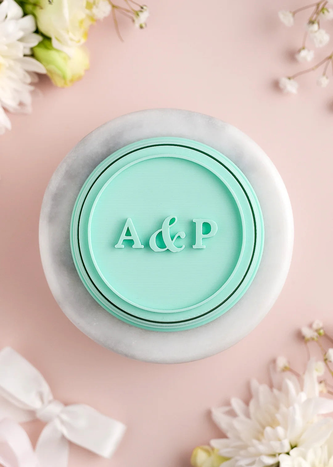 Round wedding cookie stamp with plain round border and custom initials. Example: A&P