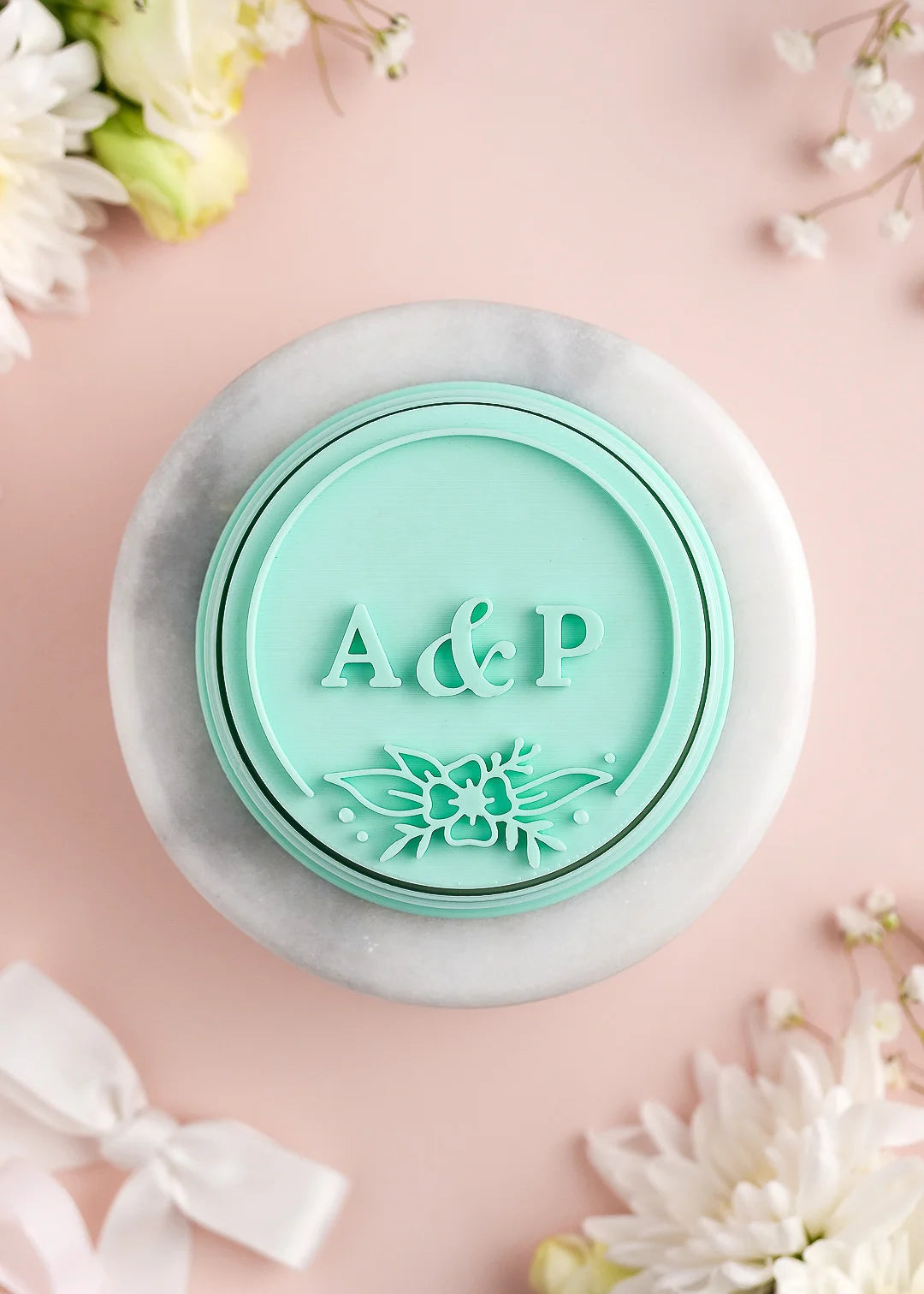 Round wedding cookie stamp with floral frame and custom initials. Example: A&P