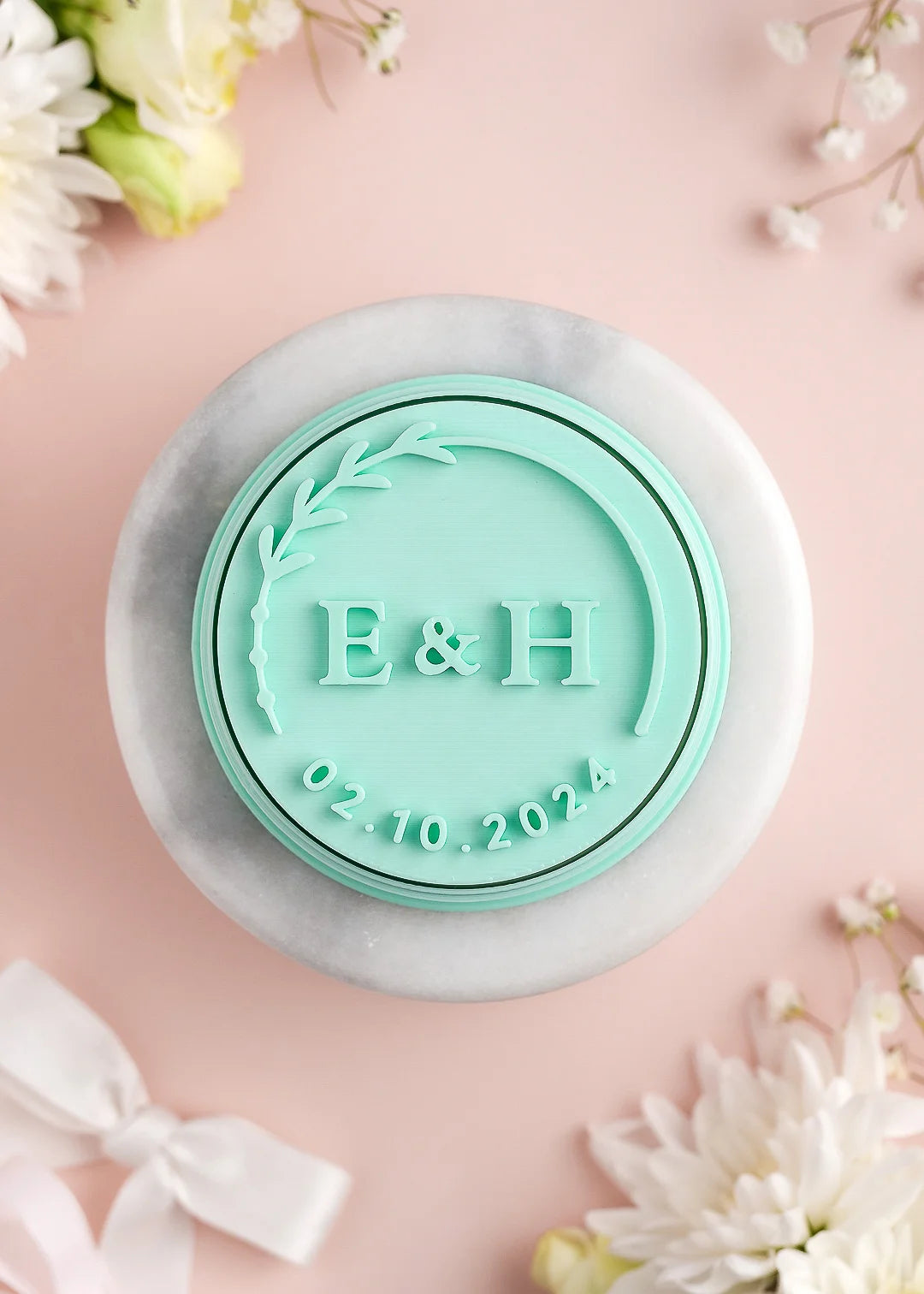 Round wedding cookie stamp with floral frame, custom initials and date. Example: E&H; 02.10.2024