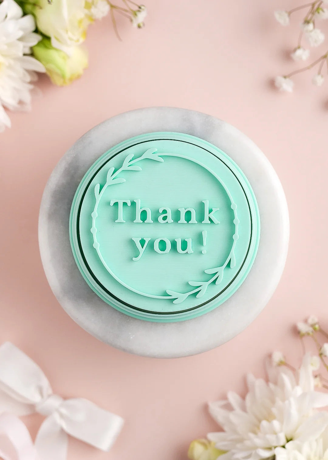Round wedding cookie stamp with floral frame and custom message. Example: "Thank you"