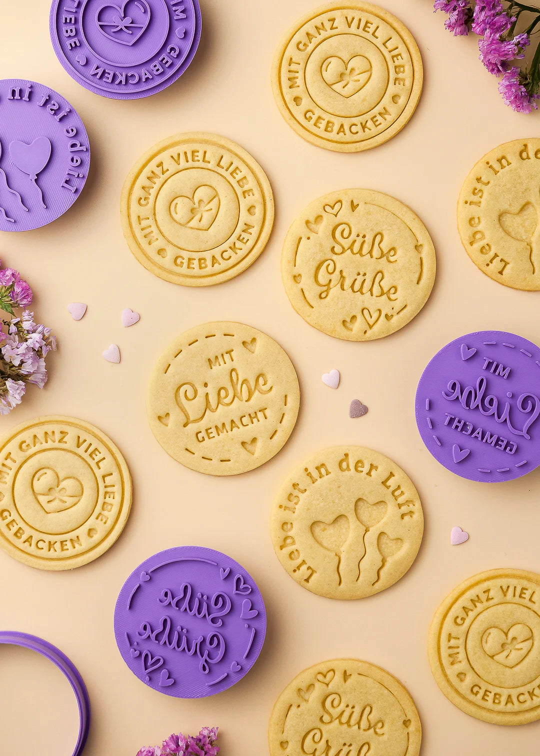 Purple cookie stamps and stamped cookies with sweet German messages, all created using our original baking tools – detailed, clean, and full of charm.