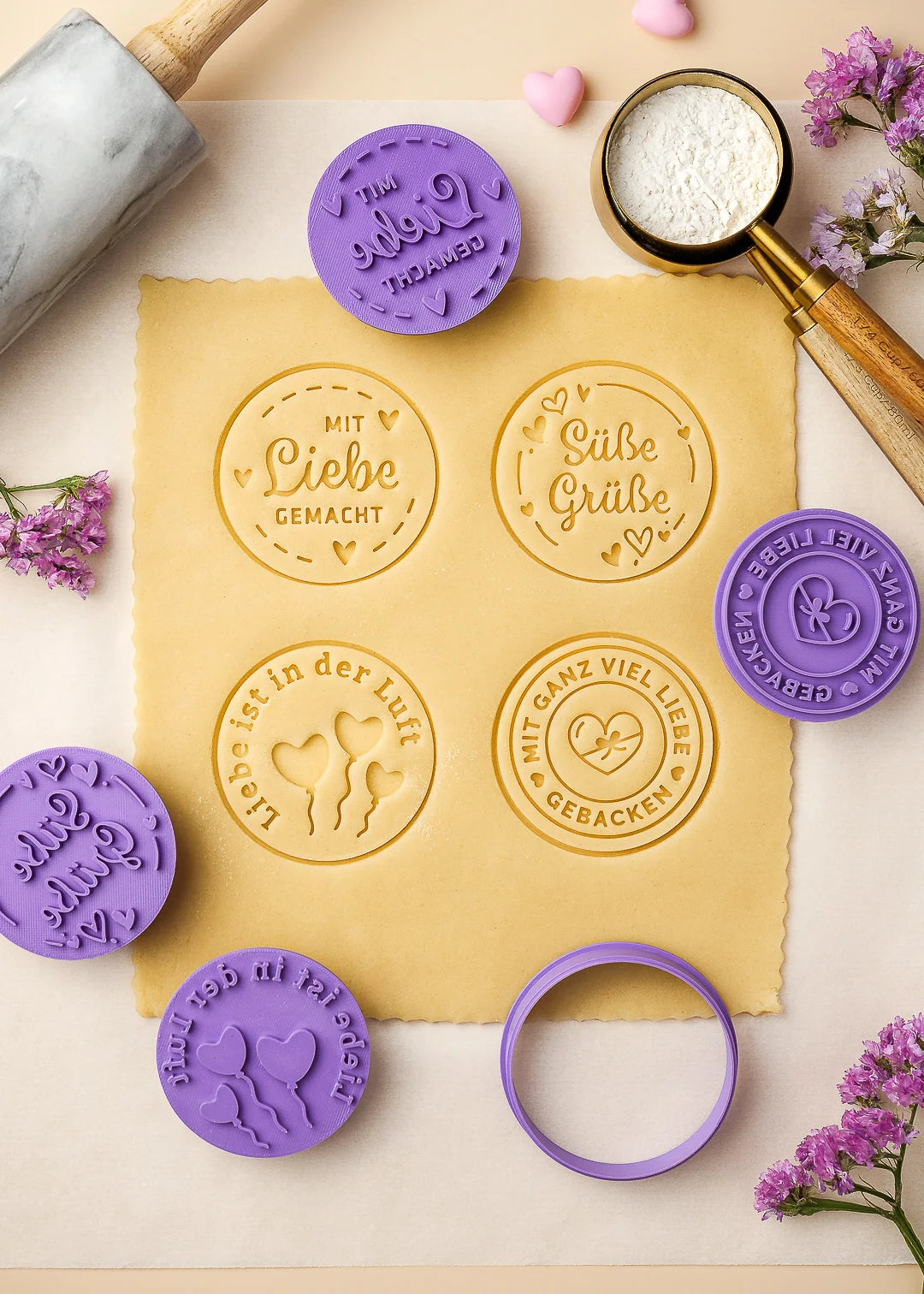 Beautifully embossed cookie dough with German messages like “Mit Liebe gemacht” and “Süße Grüße”, made using custom cookie stamps – a thoughtful DIY gift idea for birthdays, holidays, or Valentine’s Day. perfect for baking with kids or adding a sweet touch to family baking days. Made with our signature stamp set.