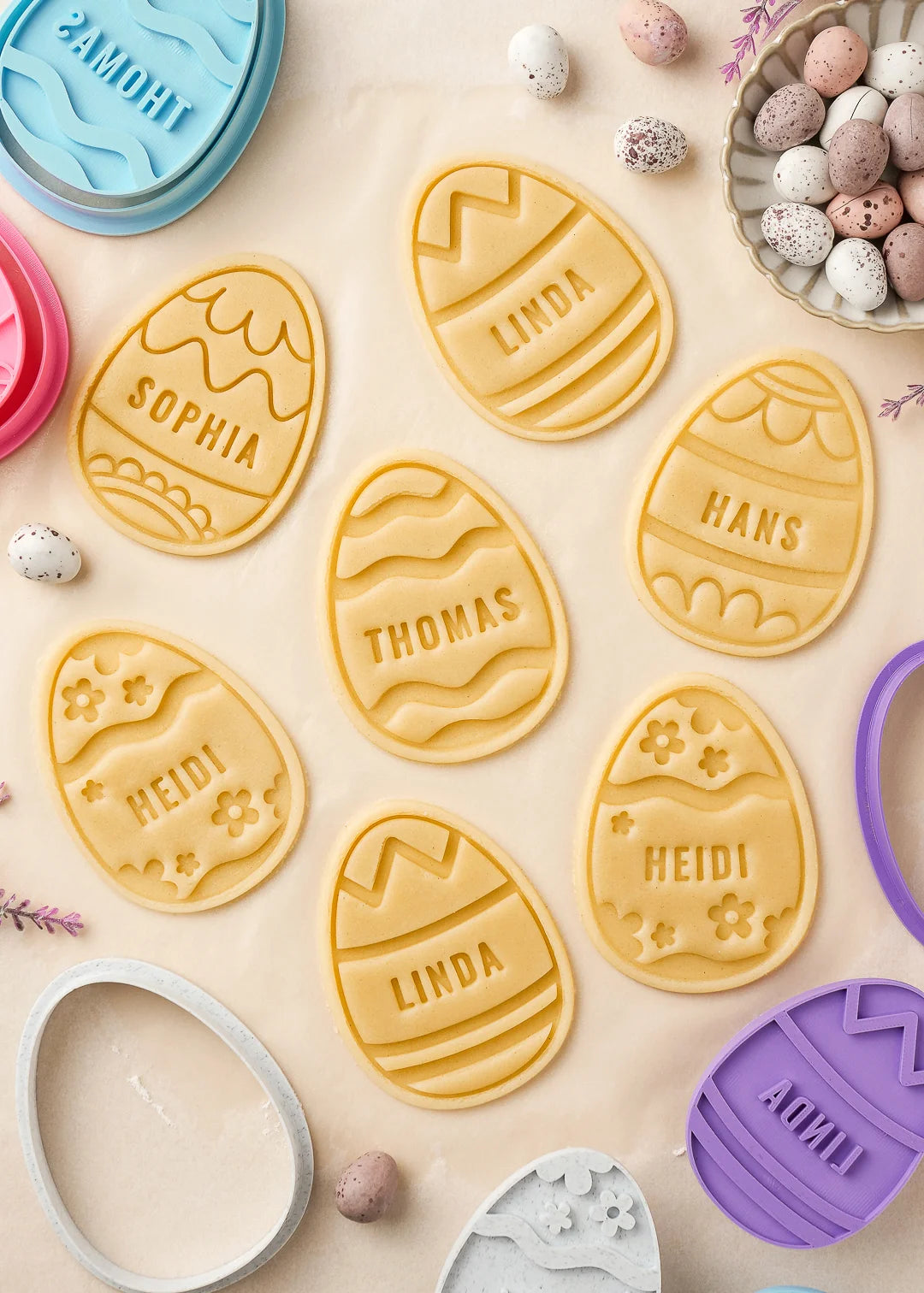 Custom embossed Easter egg cookie dough with custom names like Heidi, Hans, and Linda. Each piece is perfectly shaped using personalized cookie stamps – ideal for holiday baking and Easter treats.
