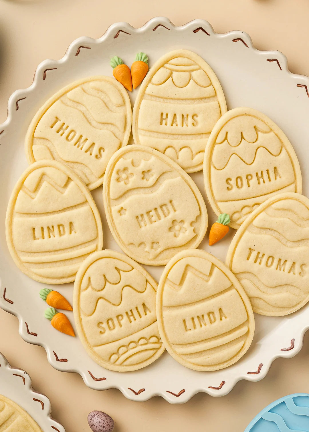 Close-up of baked Easter egg cookies personalized with different names