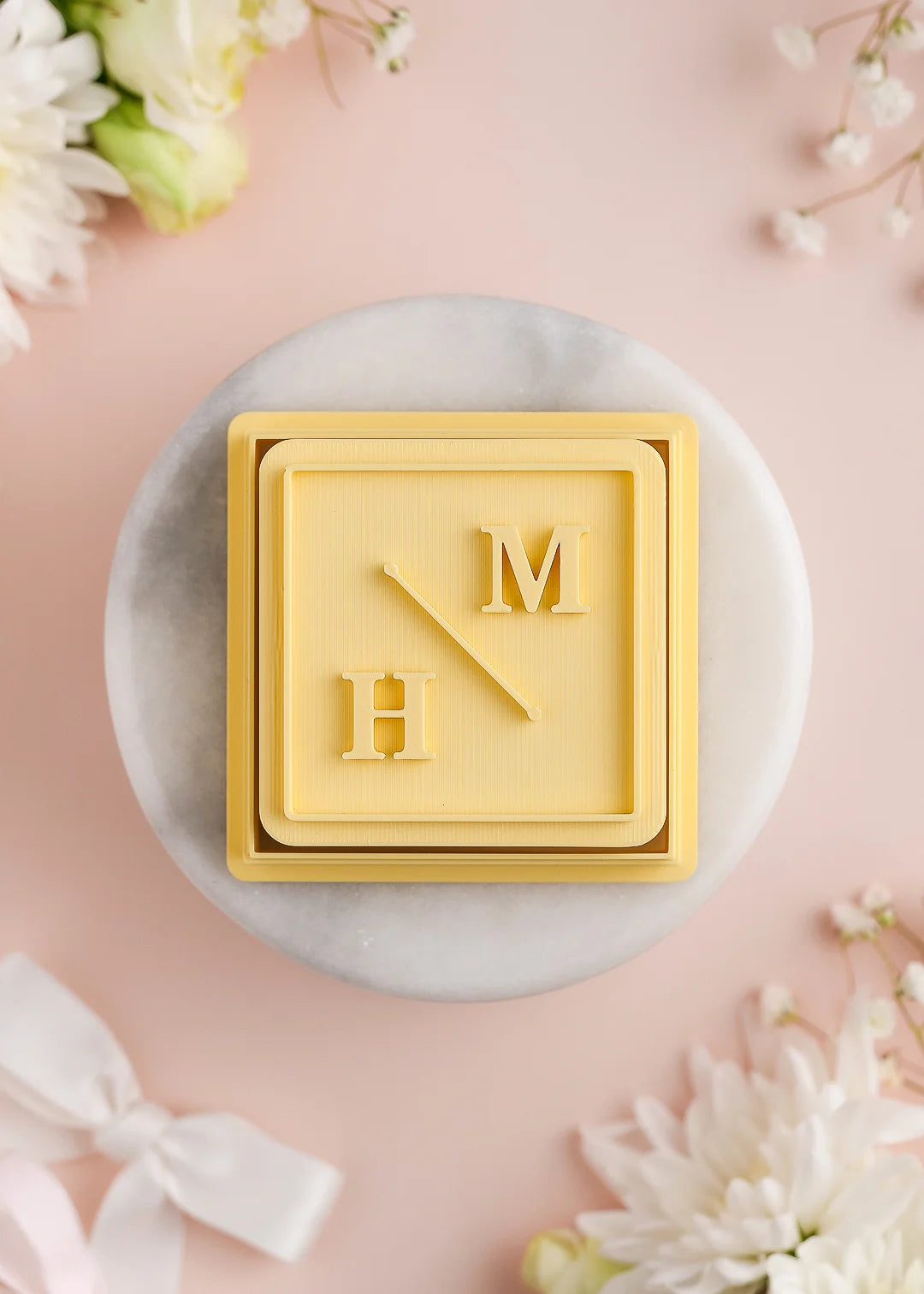 Square wedding cookie stamp with plain square frame and custom initials. Example: M H