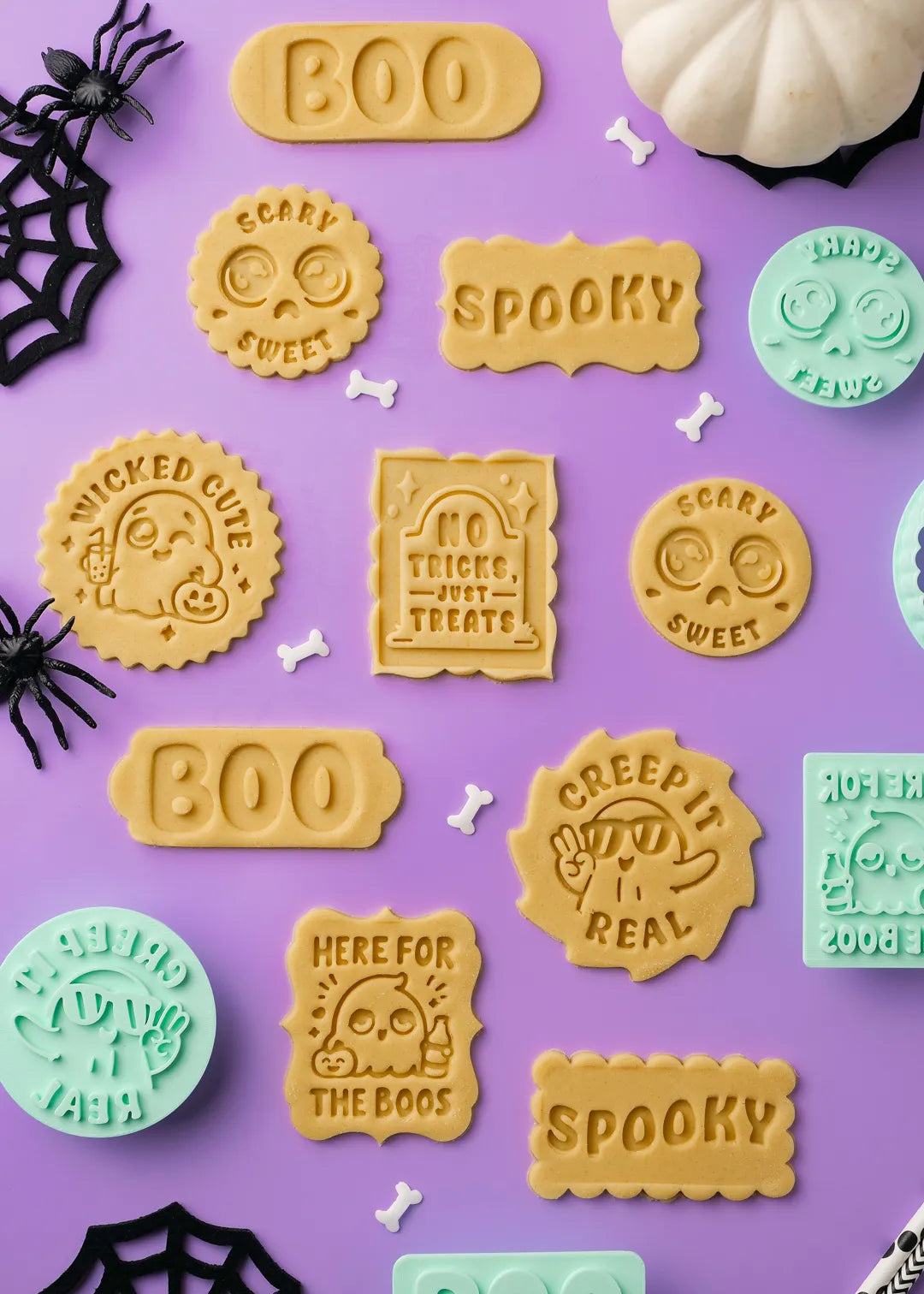 Halloween-themed cookies with text on a purple background. Featuring designs from the formini halloween collections.