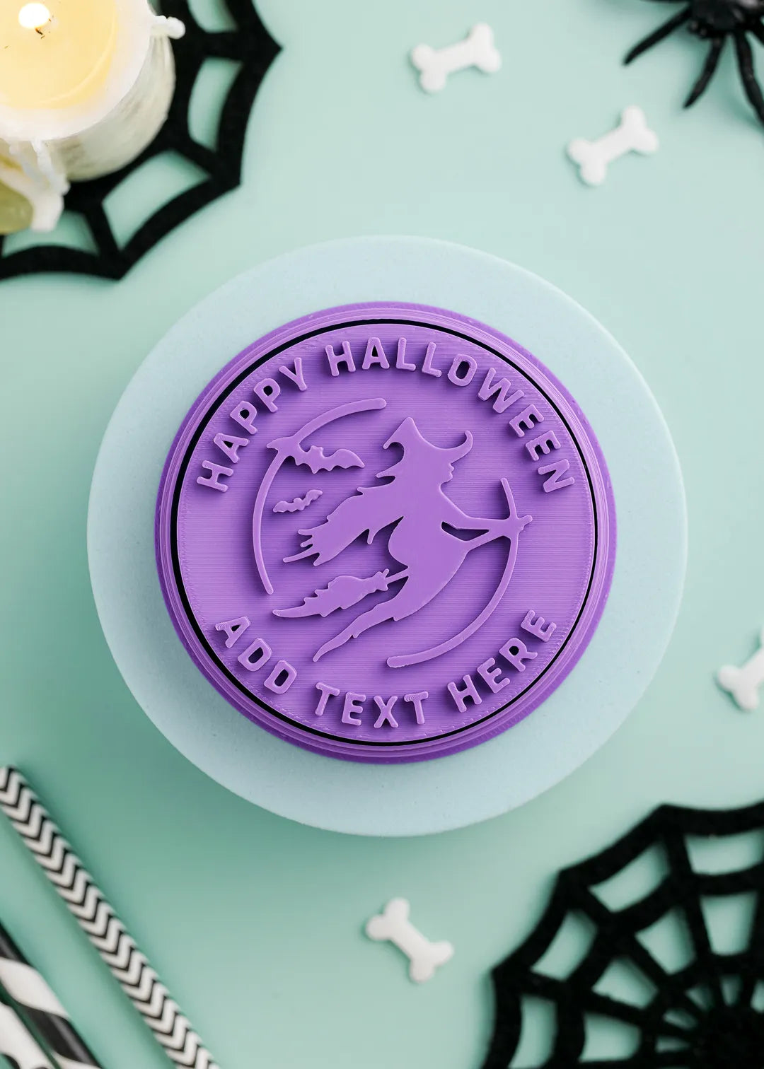 Halloween-themed purple cookie stamp with witch and option to add custom text on a green background