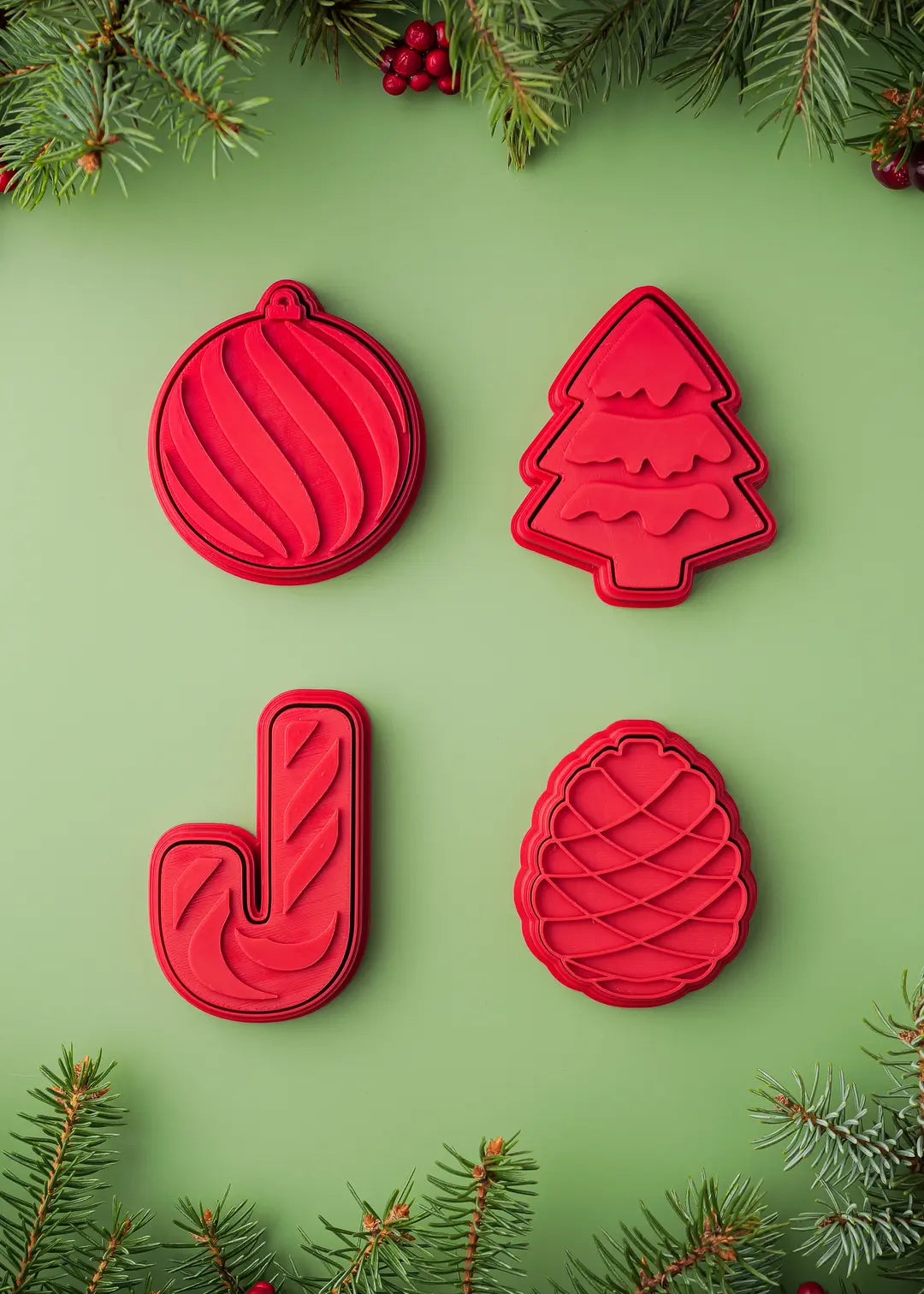 Christmas Cookie Stamps & Cutters Set. Includes Christmas ornament - 2.75 x 3 inches, Christmas tree - 2.6 x 3.2 inches, Candy Cane - 2.1 x 3.4 inches; complimentary Pinecone - 2.35 x 2.85 inches.