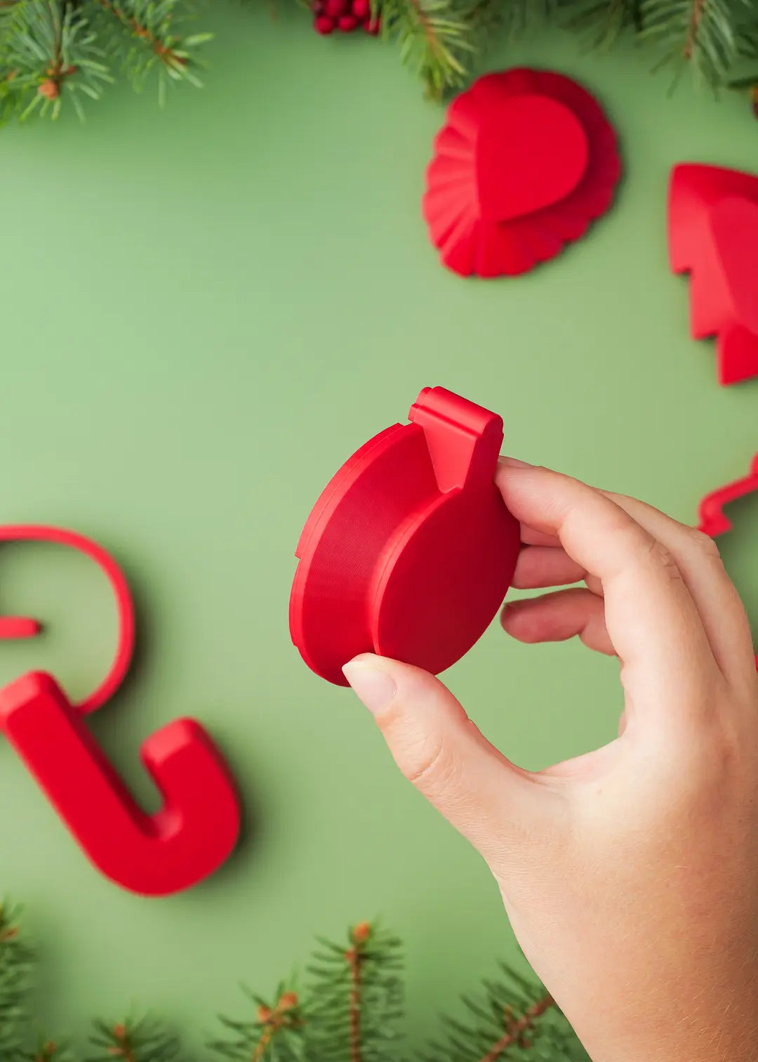 Photo of cookie stamp shown sideways to highlight its ergonomic design. All out cookie stamps are designed with a special handle for a comfortable grip.